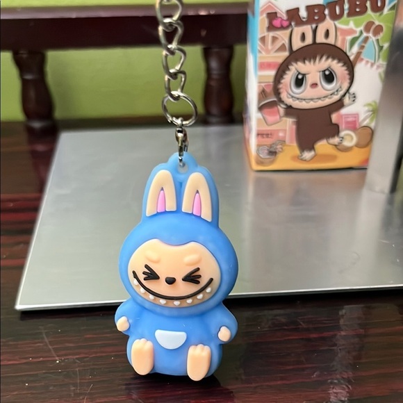 🧸 🆕 🧸 Labubu Blue Keychain Toy With Blue Pom Pom and Flower Charm#2 - Picture 7 of 13